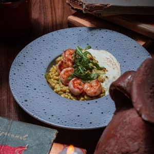 Pasta ptitim with shrimps and zucchini in a creamy sauce