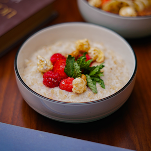 Oatmeal in coconut milk with berries and honey