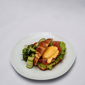 Croissant with poached egg and salmon