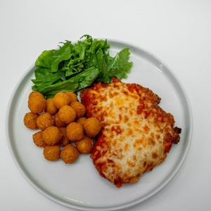 Schnitzel in tomato sauce with mozzarella and potato balls